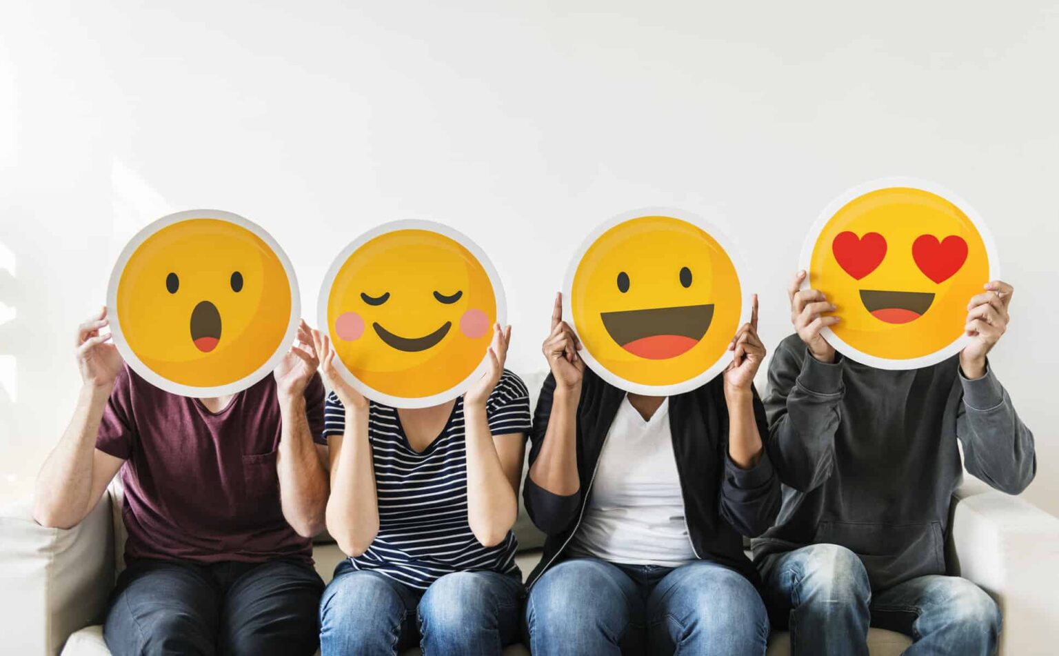 3 Rock-Solid Dividend Stocks I’d Happily Own Through at Least 2035 four people hold happy emoji masks